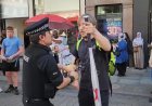 Watch: UK Police Officer Assaults Man Walking Out Of Shop With Wrapped Baseball Bat