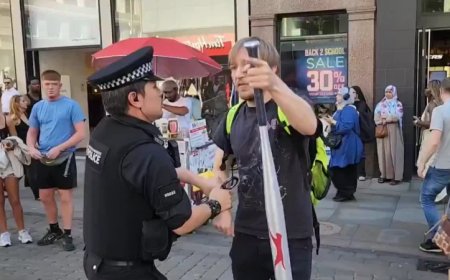 Watch: UK Police Officer Assaults Man Walking Out Of Shop With Wrapped Baseball Bat